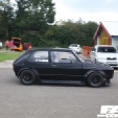 A right side view of a black VW Golf Mk1 driving at the Forge Action Day 2019