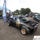 A right side view of a black and gold VW Golf Mk1 at the Forge Action Day 2019