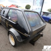 A rear left side shot of a black and gold VW Golf Mk1 at the Forge Action Day 2019