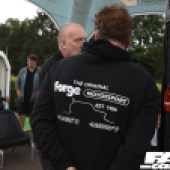 The back of a man wearing a Forge Motorsport black hoodie at the Forge Action Day 2019