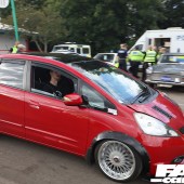 A right side view of a red Honda Fit at the Forge Action Day 2019