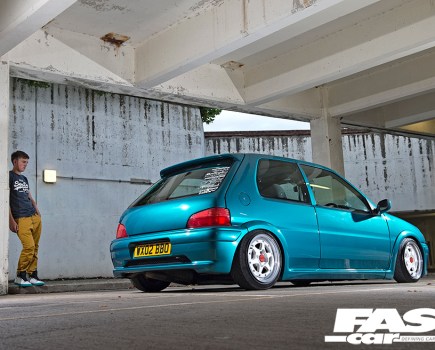 A rear right side shot of an aqua Peugeot 106 GTI