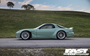 The side profile of a Rocket Bunny Mazda RX-7 FD