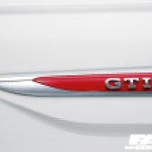 The close up of the red GTI badge on a white VW Polo GTI