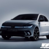 Front left shot of a white VW Polo GTI in dim light with the low headlights on
