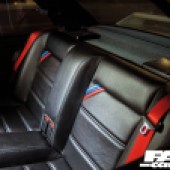 The black leather black seats inside a BMW E30 M3