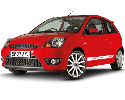 A front left side shot of a red Ford Fiesta ST Mk6 with a white background