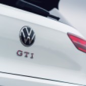 A close up of the rear logo on a white VW Golf GTI Clubsport Mk8