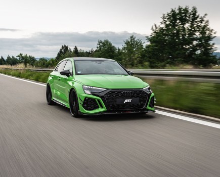 Frontal shot of a bright green Abt RS3 R driving