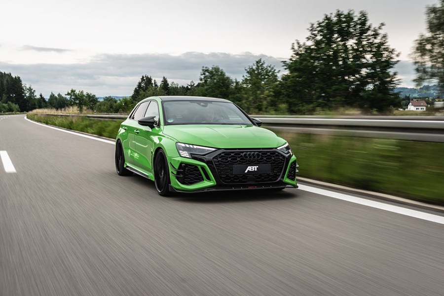 Frontal shot of a bright green Abt RS3 R driving