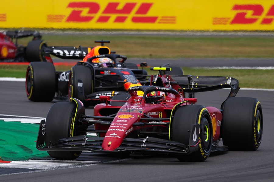 Carlos Sainz, Ferrari F1-75, leads Max Verstappen, Red Bull Racing RB18 during the British GP at Silverstone Circuit