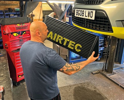 An AIRTEC intercooler being installed into our Rep to Racecar Mondeo