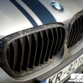 A close up of the front grill and badge of a BMW series 7