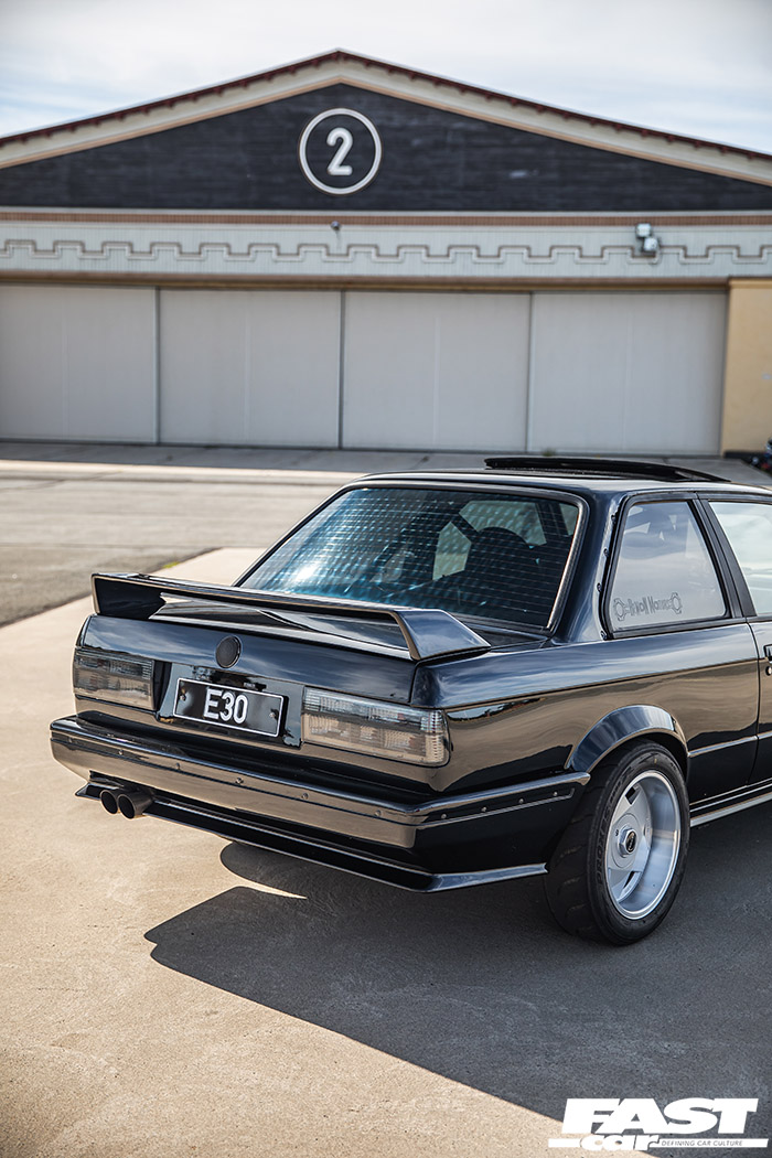 Rear portrait shot of modified bmw e30 turbo