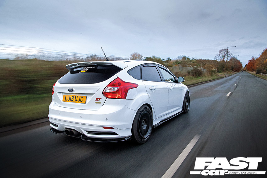 Modified Ford Focus ST Mk3 driving shot of the rear