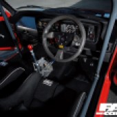 Interior of modified mk1 golf GTI equipped with roll cage and bucket seats