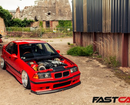 front 3/4 shot of modified bmw e36 with bonnet off