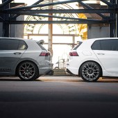 rear of modified vw golf gti mk8 and tuned golf r