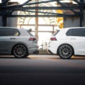 rear of modified vw golf gti mk8 and tuned golf r