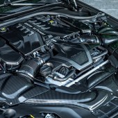 The car's engine bay contains a tuned twin-turbo V8.