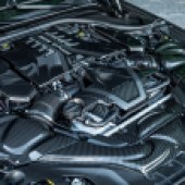 The car's engine bay contains a tuned twin-turbo V8.