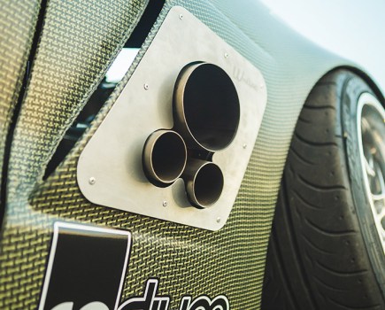 triple front exit exhaust on modified corvette