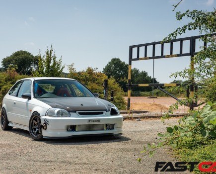 A front-quarter shot of a turbocharged EK Honda Civic