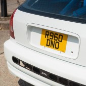 A detailed shot of the car's number plate.
