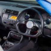 The EK Honda Civic's aftermarket steering wheel.