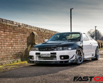 A front shot of a tuned Nissan Skyline R33 GT-R.