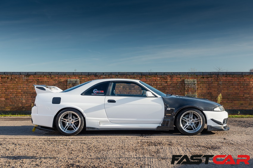 The side profile of a tuned Nissan Skyline GT-R R33.