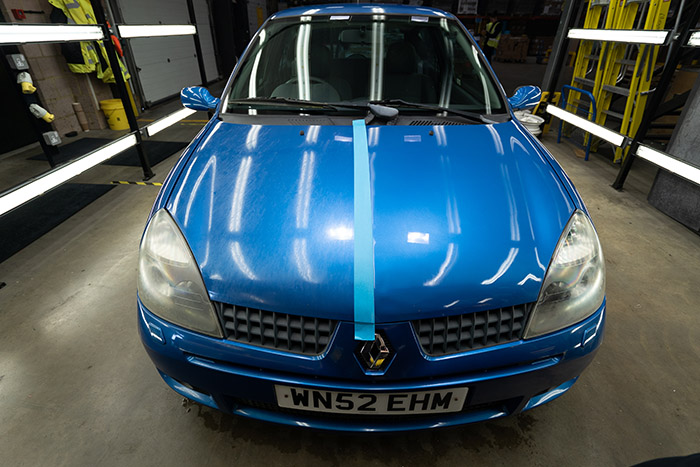 Close up of before and after paint correction on a Clio