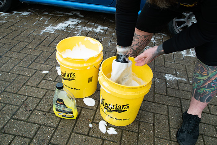 Rinse off dirt in separate bucket