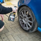 Applying the wheel cleaner to the alloy wheels