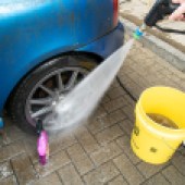 pressure washer cleaning off wheel cleaner
