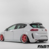 Rear 3/4 shot of modified Seat Leon FR on air lift - best air lift car