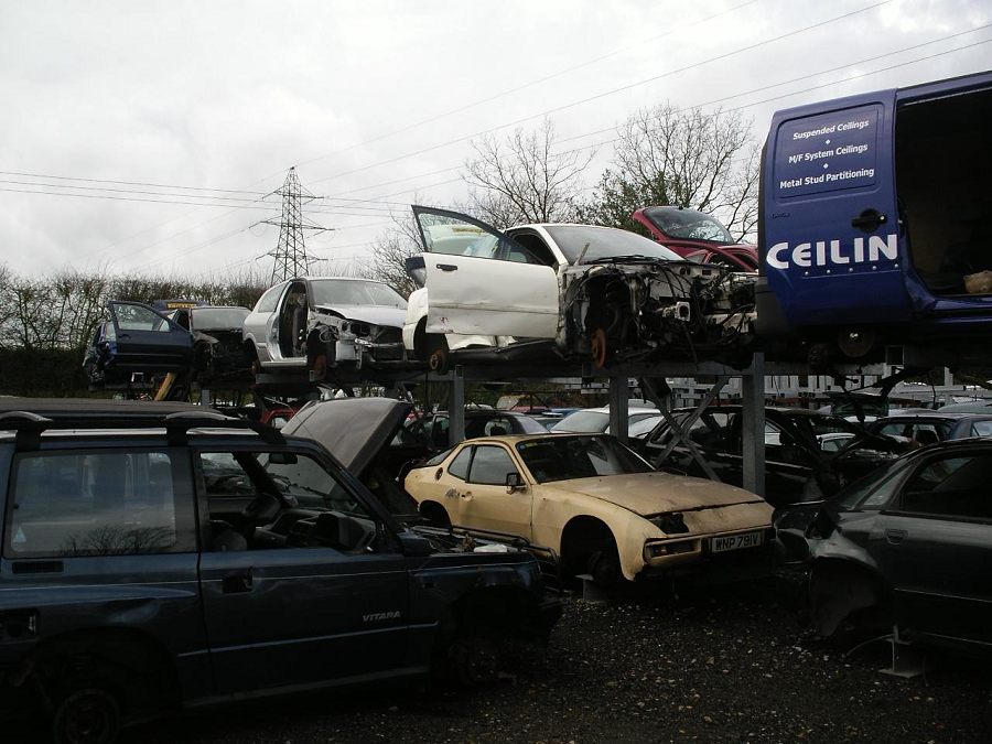 A Porsche 924 in a scrapyard.