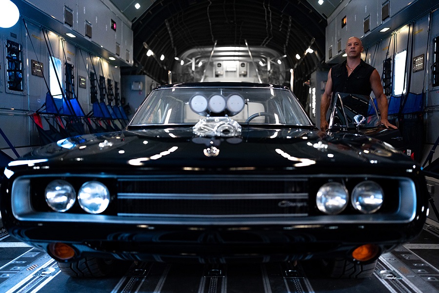 Vin Diesel starring as Dominic Toretto alongside his iconic Dodge Charger from the Fast & Furious franchise.