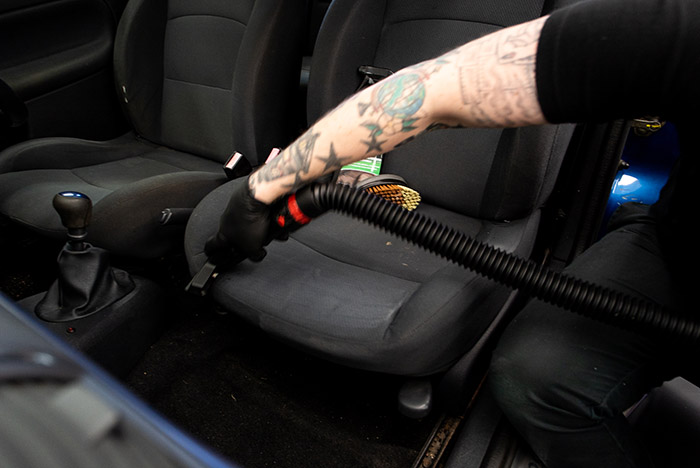 Using a vacuum on the car's interior