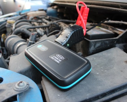 The Ring Jump-Starter 360 sitting in a Mini's engine bay.