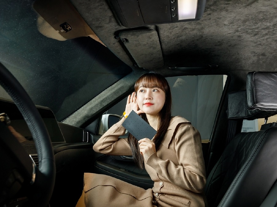 A woman listening to car audio.