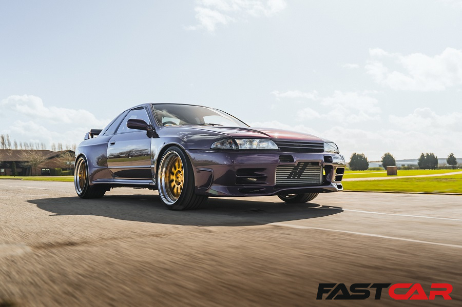 A modified Nissan Skyline R32 in motion.