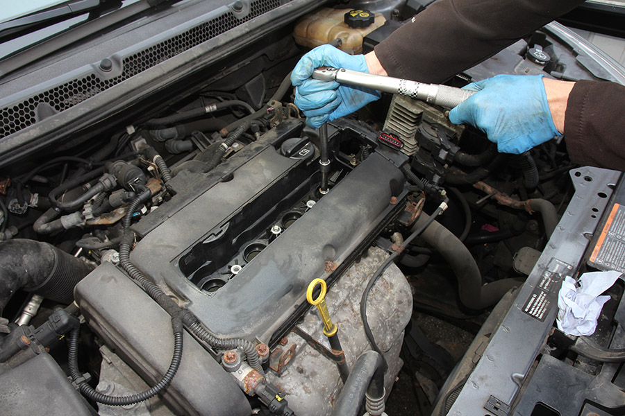 Using a torque wrench to secure spark plugs