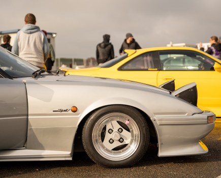 A detailed side quarter shot of an SA22 Mazda RX-7 at Japfest.