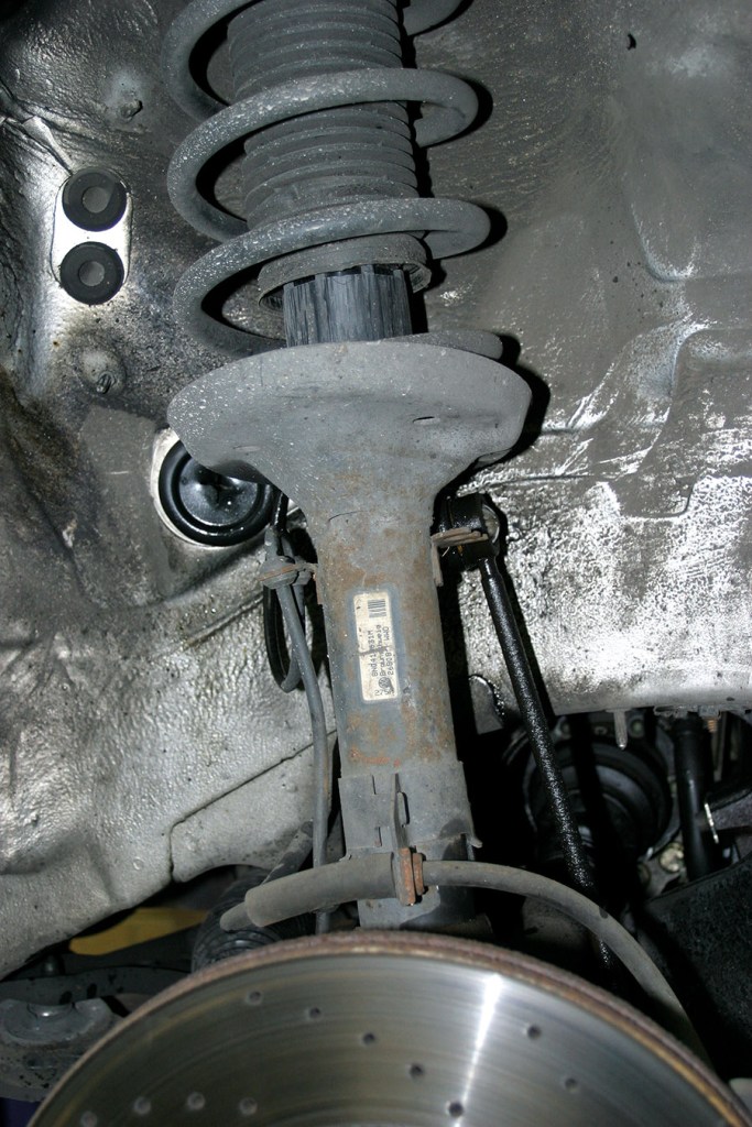 the suspension strut before installing lowering springs 
