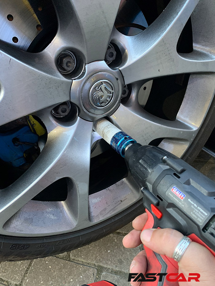 Impact wrench removing nuts