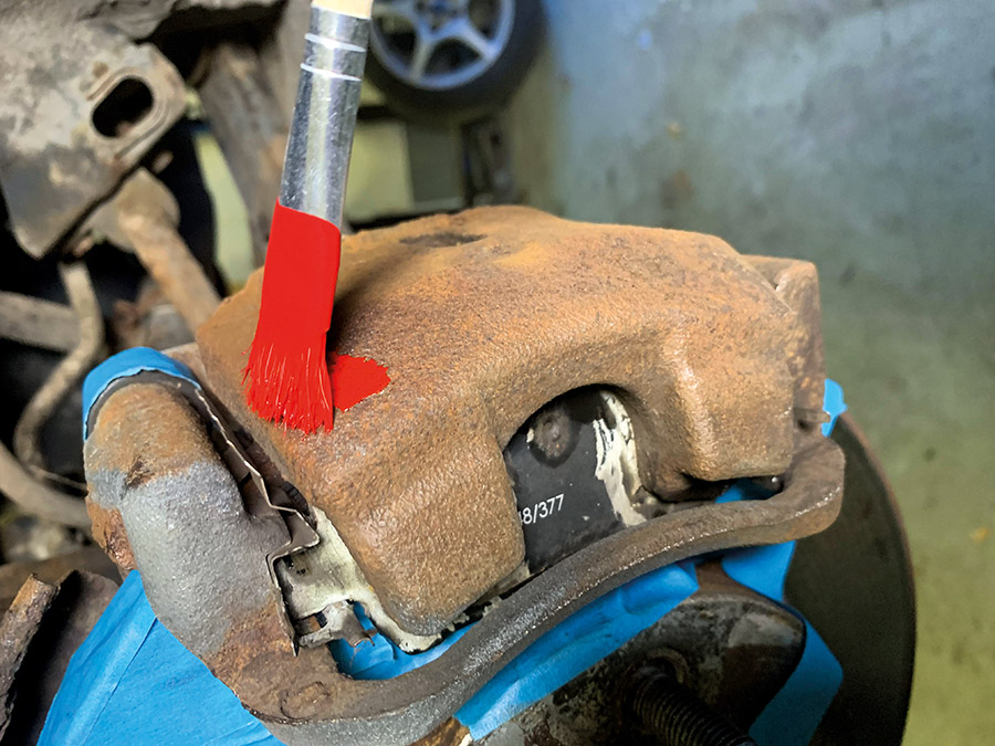 applying paint to the brake calipers 