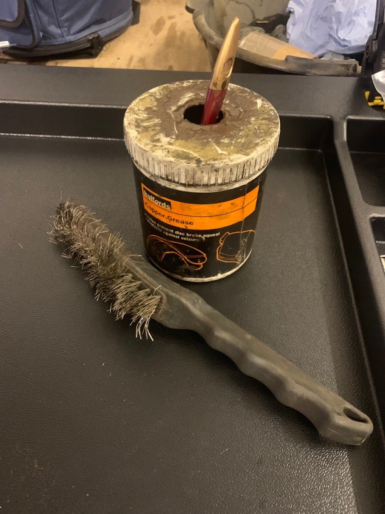 wire brush and copper grease