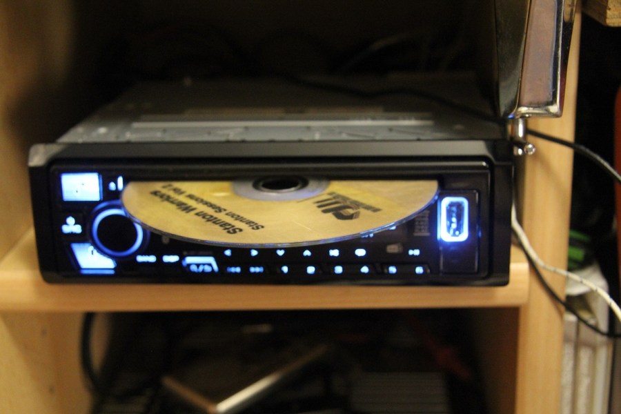 CD being inserted into KENWOOD KDC-BT960DAB