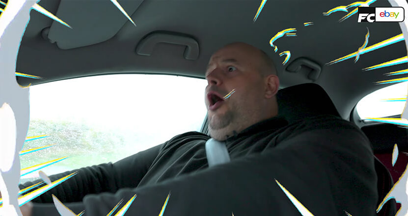 Man looking surprised at how fast his car is